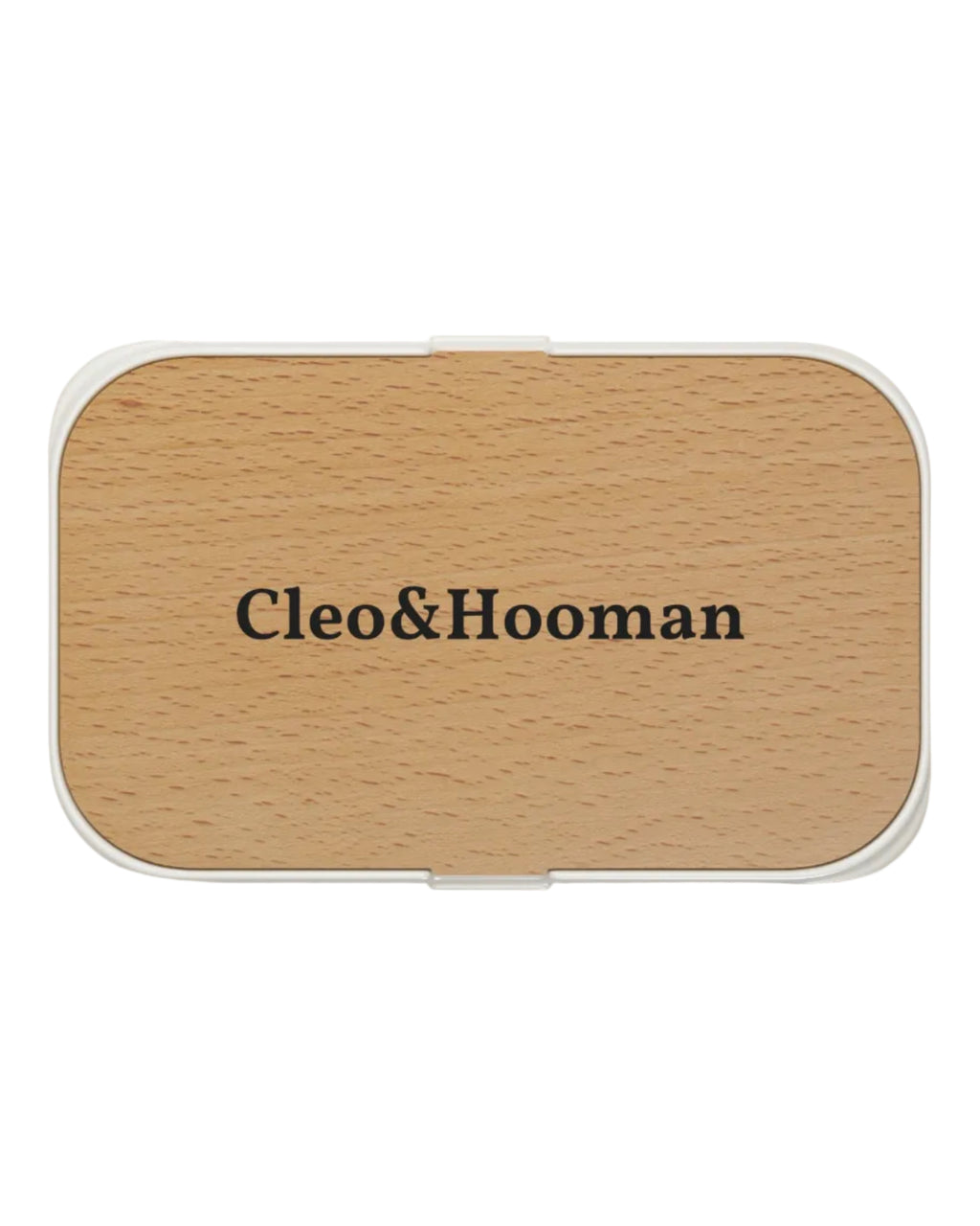 A rectangular compact case with rounded corners, featuring a light natural wood grain top and a white border, with the brand name 'Cleo&Hooman' printed in black serif text in the center.