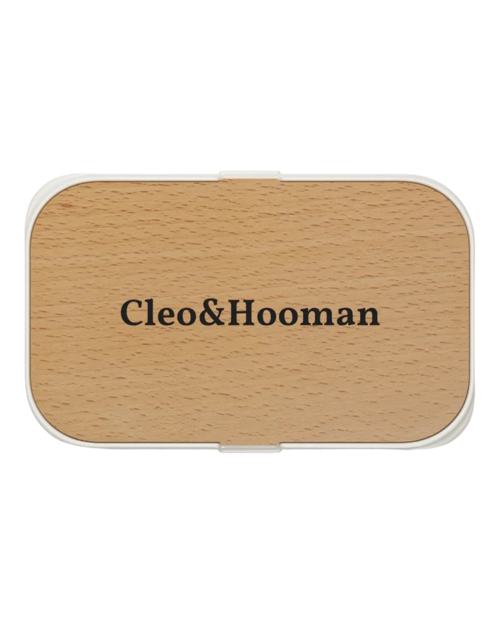 A rectangular compact case with rounded corners, featuring a light natural wood grain top and a white border, with the brand name 'Cleo&Hooman' printed in black serif text in the center.
