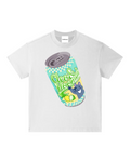 A white short-sleeve crewneck t-shirt featuring a colorful graphic of a tilted soda can with the text 'Cocktail Soda' in green script, a blue cat character, and a yellow lemon slice, shown on a plain white background.