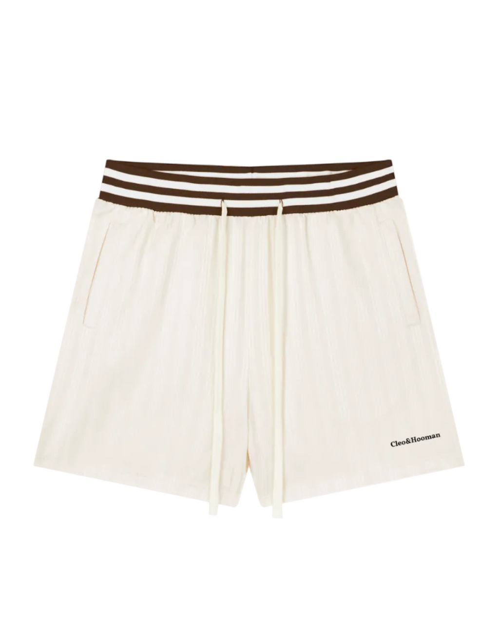 Off-white pleated shorts with a brown and white striped elastic waistband, featuring a drawstring and a small black 'Cocktail Man' logo on the lower left hem, shown against a plain white background.