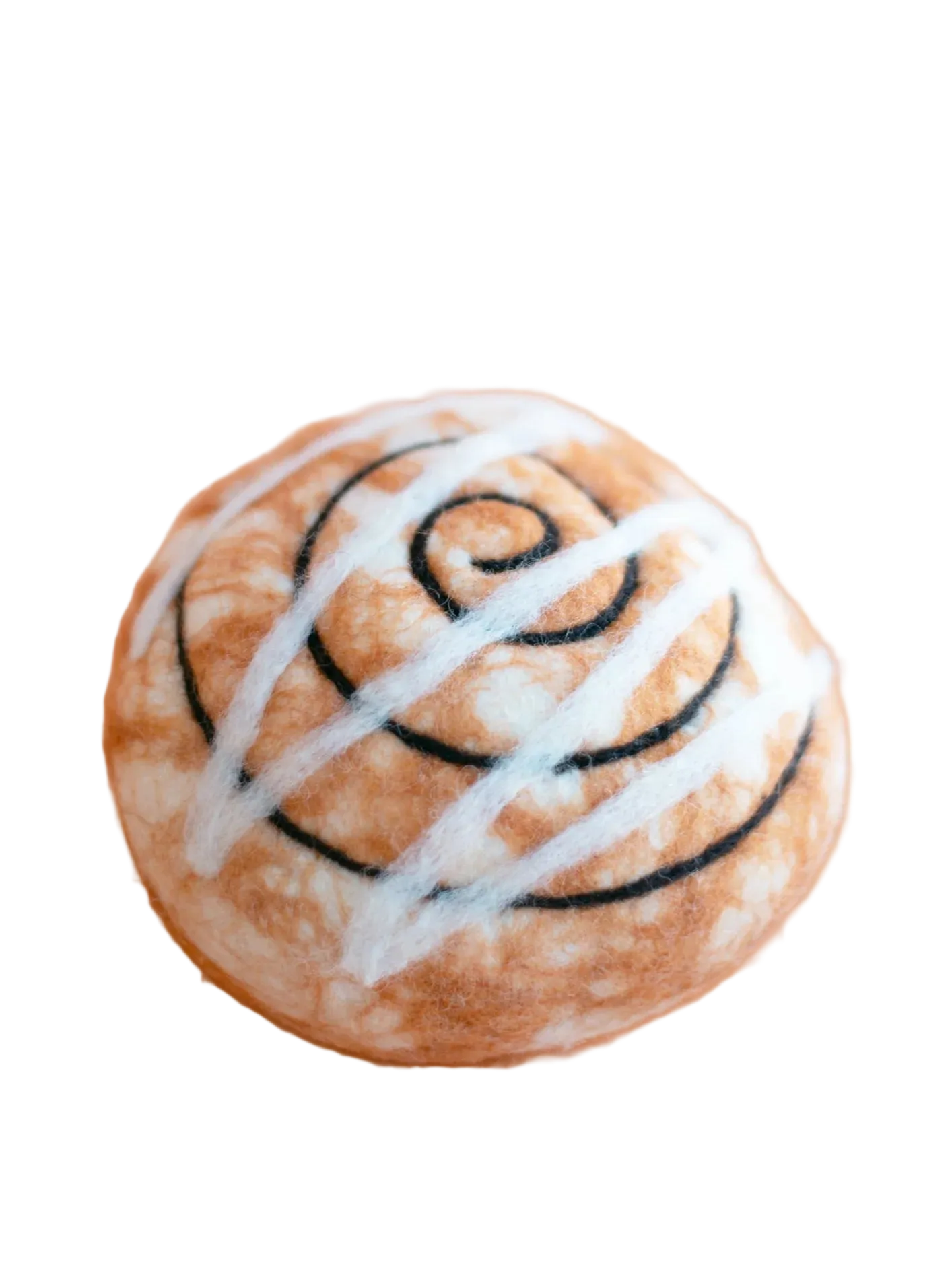 Baked good with white icing and black swirls on a beige background