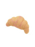Croissant-shaped dog toy with pink stitching on a beige background