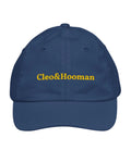 A navy blue baseball cap with 'Cleo&Hooman' embroidered in yellow across the front, shown against a plain white background.